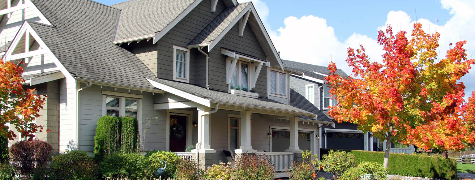 Large American beautiful house with red door.